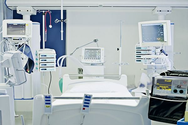 ICU critical care bay with monitors and ventilator